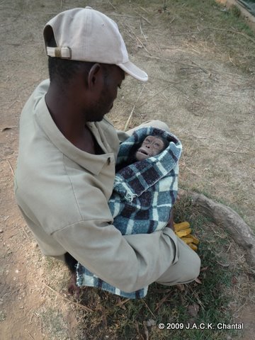 Papa Augustin keeping Ikia in his arms