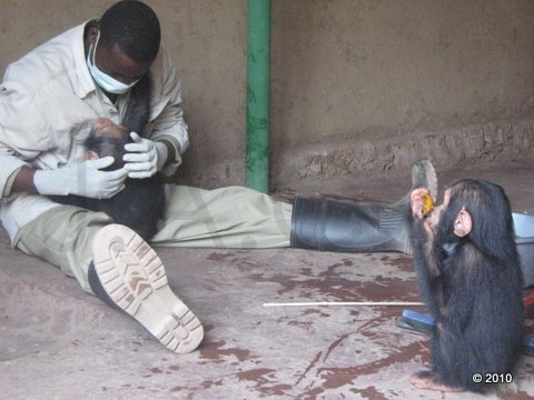 October 4th - Papa Augustin holding Tommy in his arms